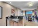 Open kitchenette concept leading to dining area and a comfortable living space at 135 E Harmon Ave # 3620, Las Vegas, NV 89109