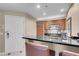 Well-equipped kitchenette with stainless steel appliances and breakfast bar seating at 135 E Harmon Ave # 3620, Las Vegas, NV 89109
