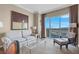 Bright living space features plush seating, modern decor, and expansive windows with city views at 135 E Harmon Ave # 3620, Las Vegas, NV 89109
