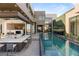 Modern home backyard features a refreshing pool and outdoor kitchen at 1491 Reims Dr, Henderson, NV 89012