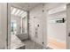Elegant bathroom showcasing a glass shower with multi-head fixtures and a bright, open design at 1491 Reims Dr, Henderson, NV 89012