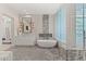 Modern bathroom featuring a soaking tub, dual vanity, and glass-enclosed shower with elegant tile work at 1491 Reims Dr, Henderson, NV 89012