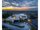 Modern luxury home with a curved driveway, lush landscaping and scenic city views at 1491 Reims Dr, Henderson, NV 89012