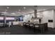 An open-concept kitchen featuring an island with bar seating, high-end appliances, and expansive city views at 1491 Reims Dr, Henderson, NV 89012