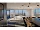 Open living area with city views, modern staircase, and stylish decor, perfect for gatherings and relaxation at 1491 Reims Dr, Henderson, NV 89012
