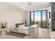 Bright main bedroom featuring a large window showcasing a stunning city view at 1491 Reims Dr, Henderson, NV 89012