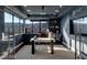 Modern home office with scenic mountain views, built-in shelving, and sleek design for a productive workspace at 1491 Reims Dr, Henderson, NV 89012