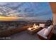 Relax on the rooftop deck by the fire pit with panoramic city views at sunset at 1491 Reims Dr, Henderson, NV 89012