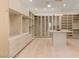Spacious walk-in closet with custom shelving, center island, and ample storage for an organized wardrobe at 1491 Reims Dr, Henderson, NV 89012