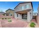 A low maintenance backyard with covered patio and hardscape, ideal for outdoor entertaining and relaxation at 15 Santo Mio Ct, Henderson, NV 89011