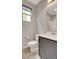 Well-lit bathroom featuring neutral colors, a functional vanity, and a contemporary mirror at 15 Santo Mio Ct, Henderson, NV 89011