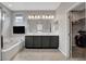 Modern bathroom with double vanity, soaking tub, and walk-in closet provides comfort and convenience at 15 Santo Mio Ct, Henderson, NV 89011