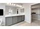 Stylish bathroom featuring a double vanity, bright lighting, and access to a spacious walk-in closet at 15 Santo Mio Ct, Henderson, NV 89011