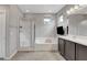 Modern bathroom with a shower, bathtub, and vanity area at 15 Santo Mio Ct, Henderson, NV 89011