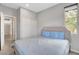 Comfortable bedroom with plush queen bed and natural light from the nearby window at 15 Santo Mio Ct, Henderson, NV 89011