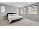 Bright bedroom featuring a comfortable bed with plenty of natural light from multiple windows at 15 Santo Mio Ct, Henderson, NV 89011