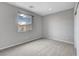 Bright bedroom featuring large window, neutral wall, carpet, and closet at 15 Santo Mio Ct, Henderson, NV 89011