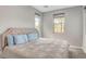Cozy bedroom with neutral walls, carpet, a queen-sized bed, and two windows for natural light at 15 Santo Mio Ct, Henderson, NV 89011