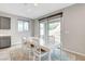 Well-lit dining room with large window and gray accents at 15 Santo Mio Ct, Henderson, NV 89011