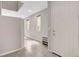 Bright foyer with neutral paint, tile flooring, natural light, and built in shoe storage at 15 Santo Mio Ct, Henderson, NV 89011