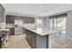 Bright and modern kitchen with a center island, stainless steel appliances, and open dining space at 15 Santo Mio Ct, Henderson, NV 89011