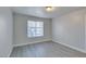 Bedroom featuring wood flooring and a bright window at 1550 Jamielinn Ln # 102, Las Vegas, NV 89110