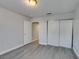 Comfortable bedroom featuring wood flooring, closet and doorway at 1550 Jamielinn Ln # 102, Las Vegas, NV 89110