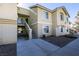 Exterior shot of tan apartment building with stairs and some with balconies at 1550 Jamielinn Ln # 102, Las Vegas, NV 89110