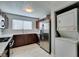 Efficient kitchen featuring stainless appliances, in-unit washer/dryer and modern cabinets with a light countertop at 1550 Jamielinn Ln # 102, Las Vegas, NV 89110