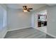 Open living space features hardwood-style floors and a glimpse into the kitchen at 1550 Jamielinn Ln # 102, Las Vegas, NV 89110