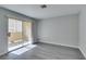 Bright living room with sliding glass doors to the patio and neutral-toned flooring at 1550 Jamielinn Ln # 102, Las Vegas, NV 89110
