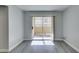 The living room features a sliding glass door for natural light and balcony access at 1550 Jamielinn Ln # 102, Las Vegas, NV 89110