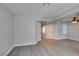 The living room has hard flooring, with a ceiling fan and ample natural light at 1550 Jamielinn Ln # 102, Las Vegas, NV 89110