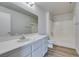 Bright bathroom features a spacious vanity, large mirror and a shower-tub combination at 1881 W Alexander Rd # 2079, North Las Vegas, NV 89032