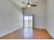 Bright bedroom with high ceilings, hardwood floors, and a sliding glass door to a balcony at 1881 W Alexander Rd # 2079, North Las Vegas, NV 89032