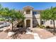 A condo building featuring a balcony and well-maintained landscaping at 1881 W Alexander Rd # 2079, North Las Vegas, NV 89032