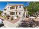 A beautiful condo building featuring balconies, desert landscaping, and a tile roof at 1881 W Alexander Rd # 2079, North Las Vegas, NV 89032