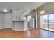 An open kitchen features a breakfast bar, white appliances, and a sliding door to the patio at 1881 W Alexander Rd # 2079, North Las Vegas, NV 89032