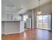 An open kitchen features a breakfast bar, white appliances, and a sliding door to the patio at 1881 W Alexander Rd # 2079, North Las Vegas, NV 89032