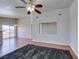 A bright living room with wood floors, big window, and neutral paint at 1881 W Alexander Rd # 2079, North Las Vegas, NV 89032