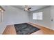 Bright living room featuring hardwood floors, a modern ceiling fan and a large window at 1881 W Alexander Rd # 2079, North Las Vegas, NV 89032