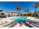 Inviting community pool with surrounding deck chairs, mature landscaping and residential buildings at 1881 W Alexander Rd # 2079, North Las Vegas, NV 89032