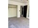 Bedroom with large closet and exterior doors, and neutral carpet at 189 Regal Sunset Ave, Henderson, NV 89002