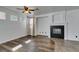 Bright living room featuring a fireplace, wood floors, and neutral wall paint at 189 Regal Sunset Ave, Henderson, NV 89002