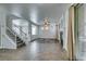 Spacious living area with staircase, wood floors, and sliding glass doors at 189 Regal Sunset Ave, Henderson, NV 89002