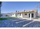 Enjoy the spacious backyard featuring a covered patio, low-maintenance landscaping, and a privacy wall at 1943 Hallwood Dr, Las Vegas, NV 89119