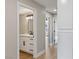 View of bathroom with quartz countertop vanity, black hardware, and modern lighting at 1943 Hallwood Dr, Las Vegas, NV 89119