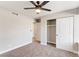 Comfortable bedroom featuring carpet, a ceiling fan, and a spacious closet at 1943 Hallwood Dr, Las Vegas, NV 89119