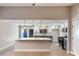 Open concept kitchen boasts a large island, stylish pendant lighting, and modern appliances at 1943 Hallwood Dr, Las Vegas, NV 89119