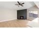 Cozy living room showcasing a charming brick fireplace, and open floor plan at 1943 Hallwood Dr, Las Vegas, NV 89119